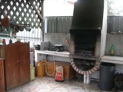 Meco Village cottages for rent open fire place in the garden